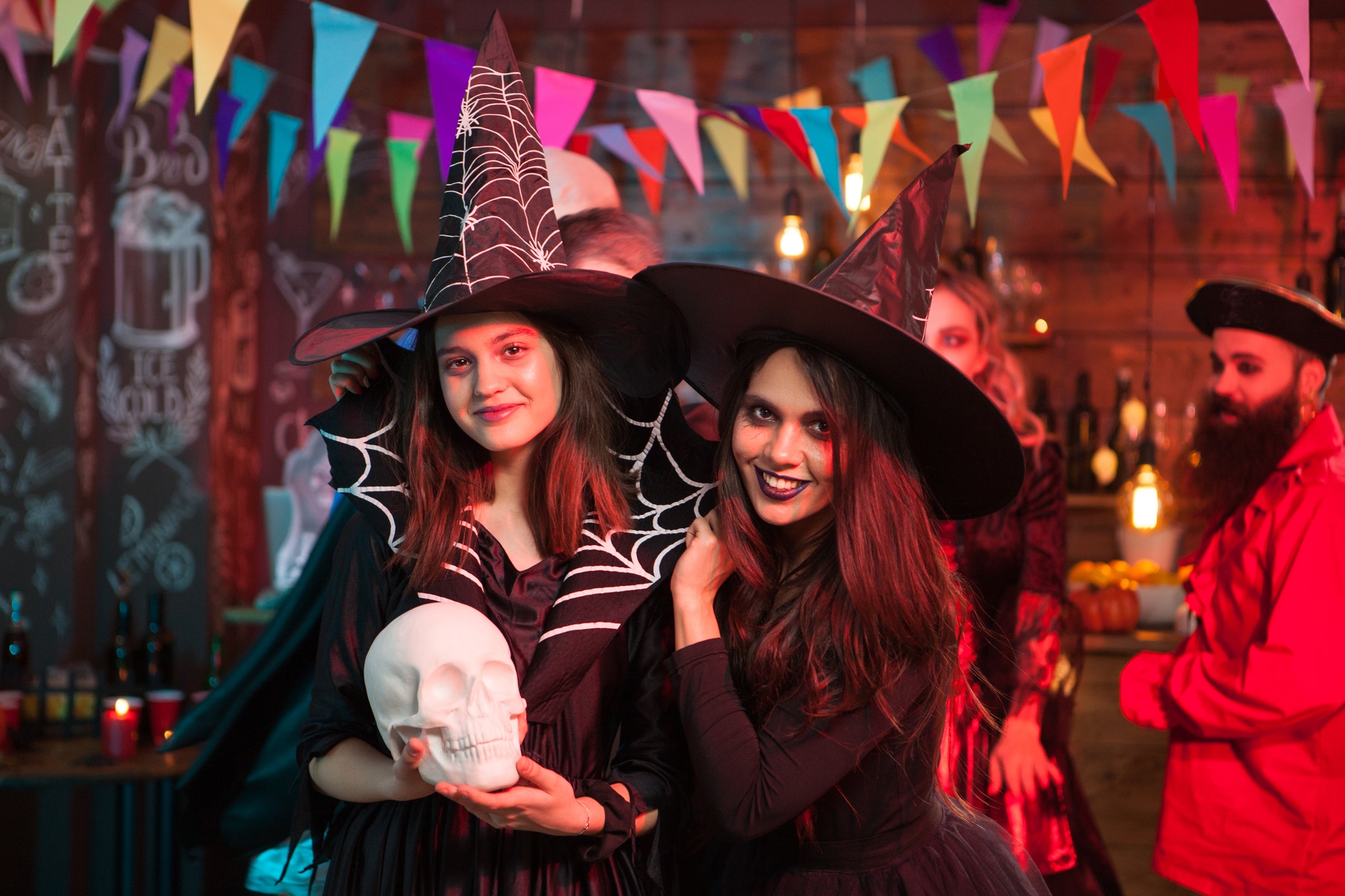 Portrait of excited young witches for halloween party